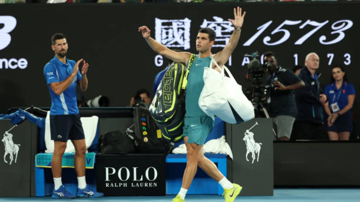 Carlos Alcaraz faces the press after falling to Novak Djokovic at the 2025 Australian Open. Photo: Getty